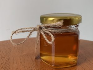 jar of honey with twine bow