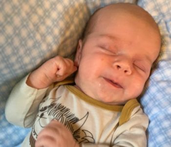 be-prepared: baby sleeping with slight smile