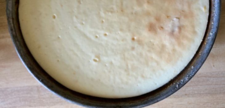 Baked cheesecake in a springform pan resembles a full moon