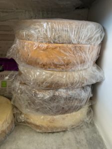 Cheesecakes stacked in a freezer