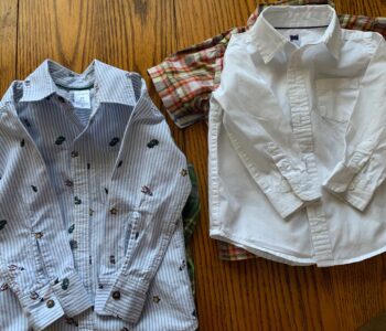 Child-sized ironed shirts stacked up