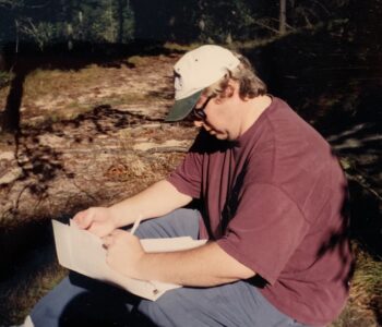 Filmmaker PJ Macomber makes notes on location.