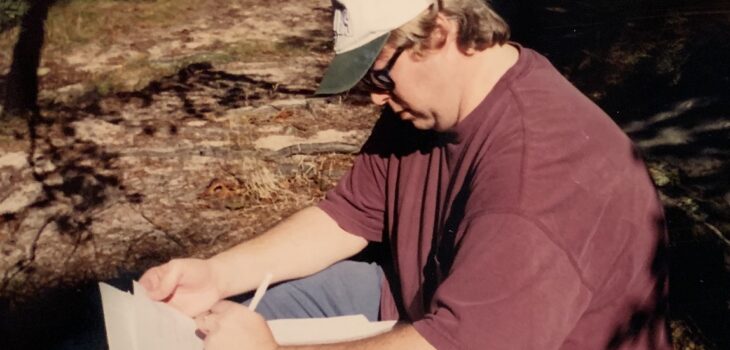 Filmmaker PJ Macomber makes notes on location.